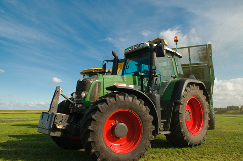 John Deere tractor with blue skies in the background